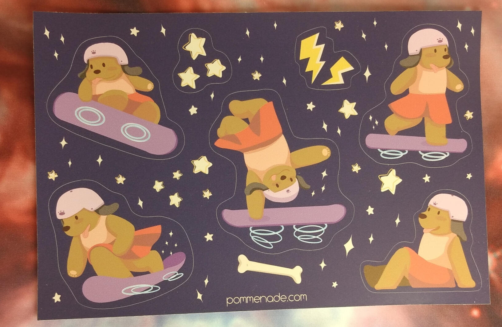 Sticker sheet featuring a dog in a pink skirt, using a hoverboard as a skateboard and doing cool tricks.
